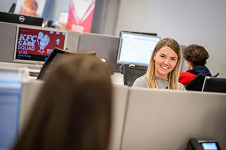 Lady in office smiling