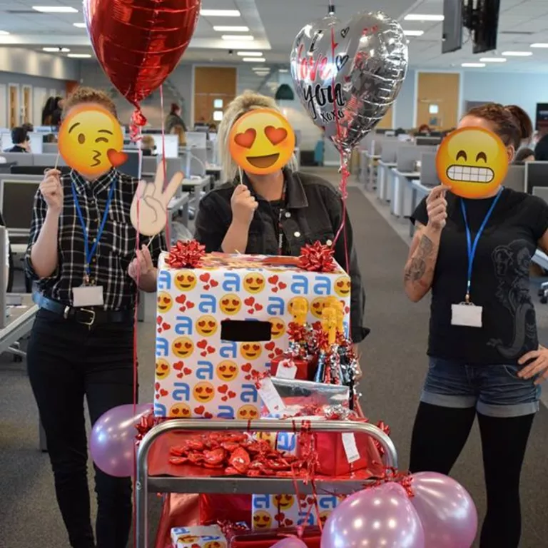 3 people celebrating with gifts for the team